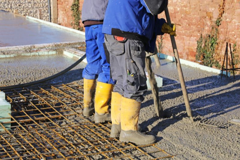 concrete workers installing concrete