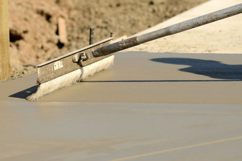 broom finish being done on concrete floor